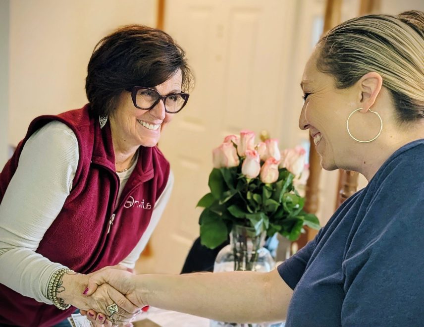 Options Estate Services team member greeting a client with a warm handshake during an estate consultation in Dayton, Ohio